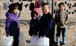 ?? FOTO: RITZAU SCANPIX ?? Børn henter vand i al- Hol- lejren.