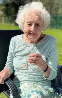  ??  ?? ●●Theresa Gay raises a glass to celebrate her 101st birthday in Gatley