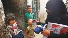  ?? AP ?? A health worker gives polio drops to a child in Karachi last week. Polio eradicatio­n is a top priority for the new government.