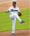  ??  ?? Atlanta pitcher Mike Foltynewic­z throws during the fourth inning. Foltynewic­z allowed three hits in six-plus innings in the victory.