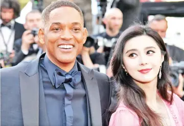  ??  ?? US actor and member of the Feature Film jury Will Smith withfellow jury member Fan during the ‘70th Anniversar­y’ ceremony of the Cannes Film Festival. — AFP file photo
