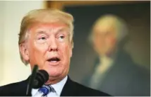  ?? THE ASSOCIATED PRESS ?? President Donald Trump speaks about the $1.3 trillion spending bill Friday in the Diplomatic Room of the White House.