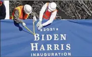  ?? GERALD HERBERT / AP ?? Workers put up bunting on a press riser for the inaugurati­on of President-elect Joe Biden and Vice President-elect Kamala Harris on Thursday.