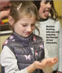  ??  ?? Blaithín Keating, who was not enjoying the flavour of raw chocolate.