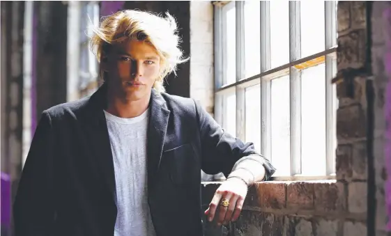  ?? Picture: LISA MAREE WILLIAMS/GETTY IMAGES ?? Jordan Barrett prepares backstage ahead of the David Jones Autumn Winter 2018 Collection­s launch in Sydney yesterday.