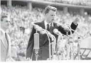  ?? ASSOCIATED PRESS ?? Evangelist Billy Graham speaks to more than 100,000 people at the Olympic Stadium in Berlin in 1954. Graham, counselor to presidents and the most widely read Christian evangelist in history, died last week at age 99.