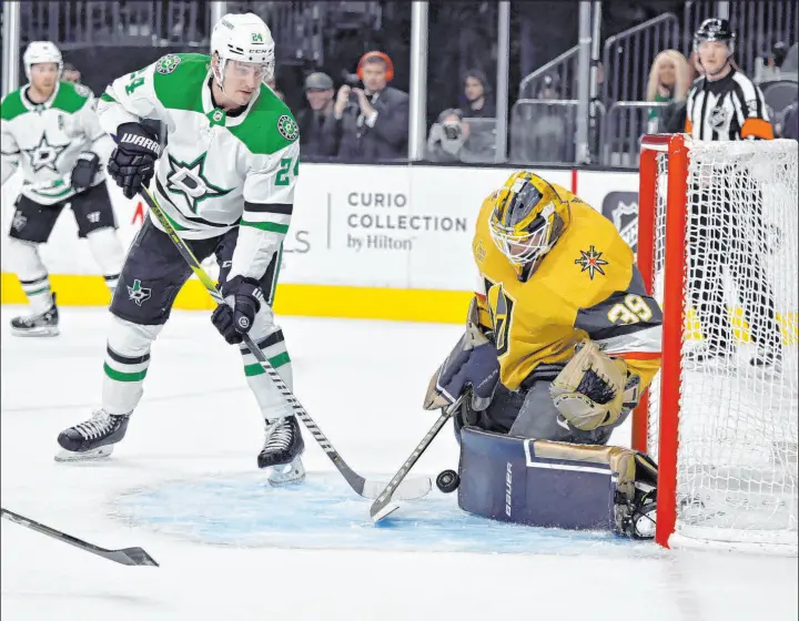  ?? David Becker
The Associated Press ?? Knights goaltender Laurent Brossoit blocks a shot Saturday by Stars center Roope Hintz, one of his 41 saves in his third straight strong start. Hintz finished with a goal.