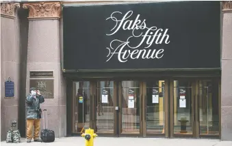  ?? PETER J. THOMPSON ?? HBC is selling a minority stake in Saks Off Fifth's online unit for US$200 million after a similar deal with Saks Fifth Avenue.
