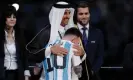  ?? The Guardian ?? Sheikh Tamim bin Hamad al-Thani, the Emir of Qatar, hugs Lionel Messi after the World Cup final. Photograph: Tom Jenkins/