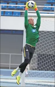  ?? THOMAS PETER / REUTERS ?? Manchester City goalkeeper Joe Hart during training at the Olympic Sports Center in Beijing on Sunday.