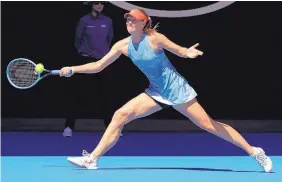  ?? AARON FAVILA/ASSOCIATED PRESS ?? Maria Sharapova hits a forehand return during her match against Harriet Dart in the first round of the Australian Open. Sharapova won 6-0, 6-0.