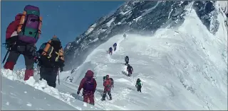  ??  ?? On the edge: Climbers attempt the treacherou­s trek to the summit in the film