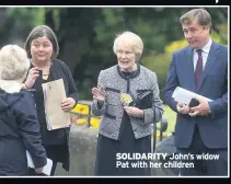  ??  ?? SOLIDARITY John’s widow Pat with her children