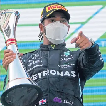 ??  ?? POINT PROVED: Lewis Hamilton celebrates victory at the Spanish Grand Prix in Barcelona, his third win in four races.
