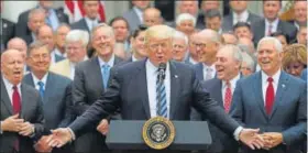  ?? REUTERS ?? Donald Trump with Congressio­nal Republican­s at the Rose Garden of the White House.