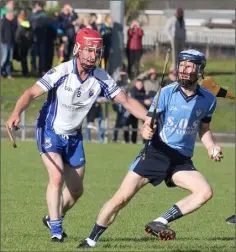  ??  ?? Jess Codd of St. Anne’s is shadowed by Craanford’s James O’Loughlin.