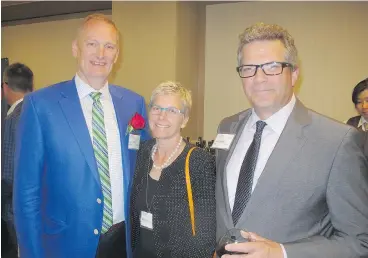  ??  ?? Award recipient AltaLink’s Scott Thon, left, and his proud wife Deb with MNP’s Tony Smith. MNP was the platinum sponsor of the 10th anniversar­y of the awards evening held at the Westin.