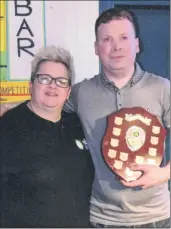  ?? ?? POOL CLASSIC: Annie McGrath, wife of the late Brian McGrath, pictured here presenting the Brian McGrath Memorial Shield to Pool Classic champion 2023-2024, Darren Dingivan, following the final recently.
