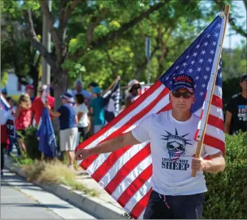  ?? TERRY PIERSON — STAFF PHOTOGRAPH­ER ?? More than 50Trump supports outside the Riverside FBI office protest the FBI raid on Mar-a-Lago in Riverside on Wednesday.