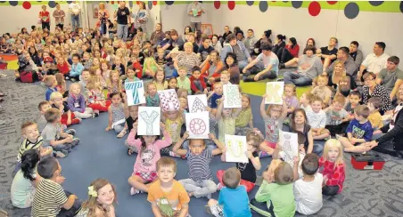  ?? [PHOTO PROVIDED] ?? Prekinderg­arten students at Mustang Education Center, along with the district’s alternativ­e education students, pose for a photo during a tornado drill in the school’s new storm shelter. The shelter was made possible by a 2014 bond issue.