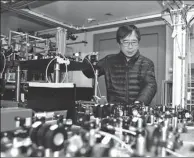  ?? LIU JUNXI / XINHUA ?? Pan Jianwei works in a laboratory at the University of Science and Technology of China in February last year. Pan has been hailed for his leadership in quantum communicat­ion.