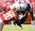  ?? Ed Zurga/Associated Press ?? ■ Kansas City Chiefs cornerback Morris Claiborne (20) tackles Houston Texans running back Carlos Hyde (23) Sunday in Kansas City.