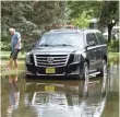  ?? JOE LEWNARD/ DAILY HERALD ?? Big Bend Drive in Des Plaines is still flooded Saturday after heavy overnight rain caused the Des Plaines River to rise about a foot.