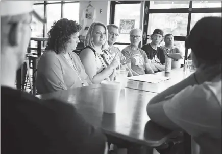  ?? PHOTOS BY LUKE SHARRETT / THE NEW YORK TIMES ?? A therapist leads a mandatory workshop related to addiction recovery at DV8 Kitchen in Lexington, Ky. Having seen the tragedy of drug abuse played out by too many of their past employees, DV8 owners Diane and Rob Perez decided to hire people struggling with addiction and focus the restaurant’s business model on assisting in workers’ recovery.