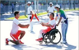  ?? XINHUA ?? The torch relay for China’s 14th National Games enters its final stage before the cauldron is lit at the newly built Xi’an Olympic Sports Center on Sept 15.