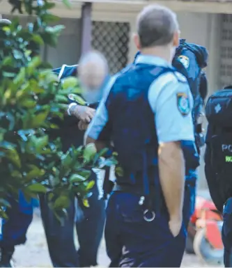  ??  ?? An alleged member of the Tweed Heads chapter of the Lone Wolf Outlaw Motorcycle Gang is arrested by police at Kunghur in Northern New South Wales.