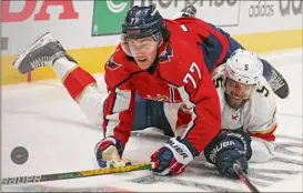  ?? Patrick Smith / Getty Images ?? Washington’s T.J. Oshie, on top, and Florida’s Aaron Ekblad battle during their Game 4 playoff matchup in Washington on Monday.