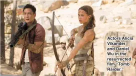  ??  ?? Actors Alicia Vikander and Daniel Wu in the resurrecte­d film “Tomb Raider.”