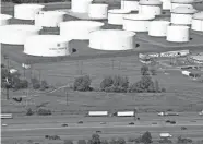  ??  ?? Oil storage tanks owned by Colonial Pipeline in Linden, N.J. MARK LENNIHAN/AP FILE