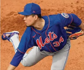  ?? Jeff Roberson/Associated Press ?? Mets pitcher Kodai Senga throws a bullpen session during spring training practice on Thursday in Port St. Lucie, Fla.