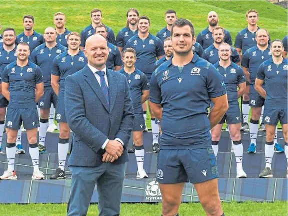  ?? Picture: SNS. ?? Scotland head coach Gregor Townsend with his captain Stuart McInally and some of the squad for the Rugby World Cup.