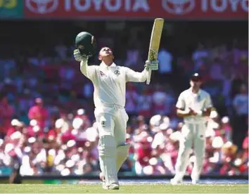  ?? AP ?? Australia’s Usman Khawaja celebrates after completing his century against England during the third day of the fifth Ashes Test in Sydney yesterday.