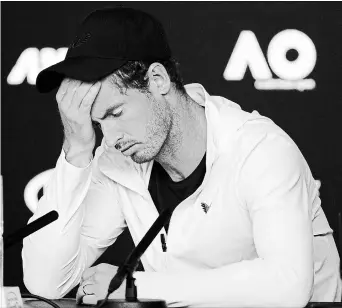  ?? KIN CHEUNG THE ASSOCIATED PRESS ?? Britain’s Andy Murray reacts during a news conference following his first-round loss to Spain’s Roberto Bautista Agut at the Australian Open tennis tournament Monday.