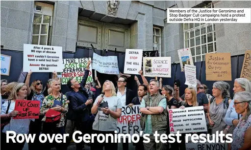  ??  ?? Members of the Justice for Geronimo and Stop Badger Cull campaigns hold a protest outside Defra HQ in London yesterday