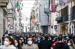  ?? CECILIA FABIANO / LAPRESSE VIA AP ?? People crowd Via del Corso shopping street in Rome on Feb. 7 following the ease of restrictio­n measures to curb the spread of COVID-19.
