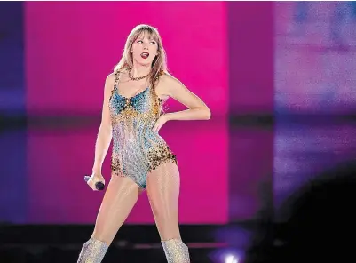  ?? THE KANSAS CITY STAR FILE PHOTO ?? Taylor Swift pauses between songs during her first of three sold-out concerts at AT&T Stadium in Texas, in March.