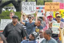  ?? Godofredo A. Vasquez / Houston Chronicle ?? Protesters object to the proposed Senate health care measure outside Houston’s City Hall.