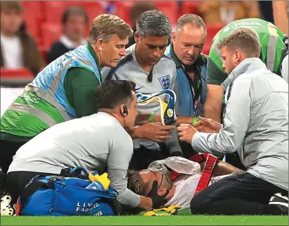  ??  ?? NIGHTMARE: England were dealt a massive injury blow as full back Luke Shaw was stretchere­d off just after half time