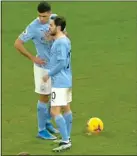  ??  ?? STAND DOWN: Ederson (left) ambles forward to give Bernardo Silva some advice for the penalty taker, but Rodri ignored it and still managed to score