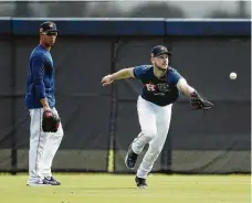  ??  ?? The slick defensive work by Astros outfielder Kyle Tucker, right, in 2020 earned him a spot among the Gold Glove finalists.