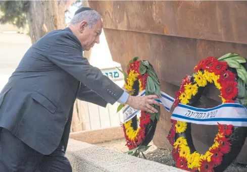  ?? EPA ?? Israeli Prime Minister Benjamin Netanyahu places a wreath on Wednesday during a memorial service for the victims of the 1948 ‘Altalena’ ship attack.