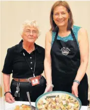  ??  ?? Tasters D Macfarlane from Cornerston­e Deli, pictured right, with Catriona Innes at Taste of BOOKMARK