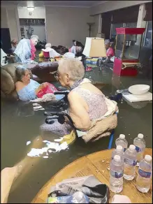  ?? AP ?? Photo shows the residents of the La Vita Bella nursing home in Texas sitting in waist-deep flood waters caused by Hurricane Harvey.