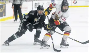  ?? JASON MALLOY/THE GUARDIAN ?? Saint John Vitos forward breaks to the middle of the ice and looks for a shooting lane as Charlottet­own Bulk Carriers Pride Sam MacNeill gives chase.