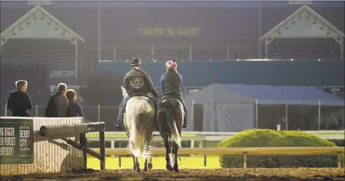  ?? Charlie Riedel / Associated Press ?? Kentucky Derby hopeful Gray Magician is led onto the track for a workout at Churchill Downs on Tuesday in Louisville, Ky. The 145th running of the Kentucky Derby is scheduled for Saturday.