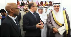  ??  ?? United States Ambassador Douglas Silliman speaks to Informatio­n Minister Sheikh Salman Al-Humoud Al-Sabah at the exhibition.